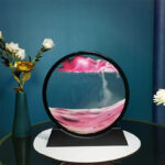 ساعت شنی طرح شن های رنگی شناور در آب